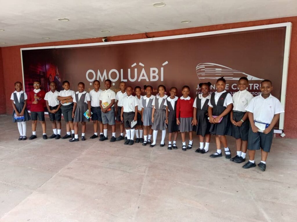 J Randle Museum Visit: Pampers Private School learners taking group photo after museum tour. Tour Africa Mag.