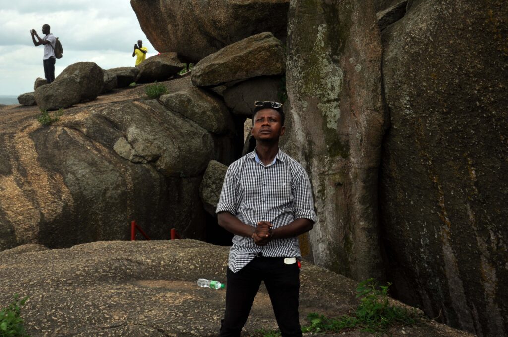 About us: Tour Africa transforming tourism with AI. Photographer on the Olumo Rock in Abeokuta.