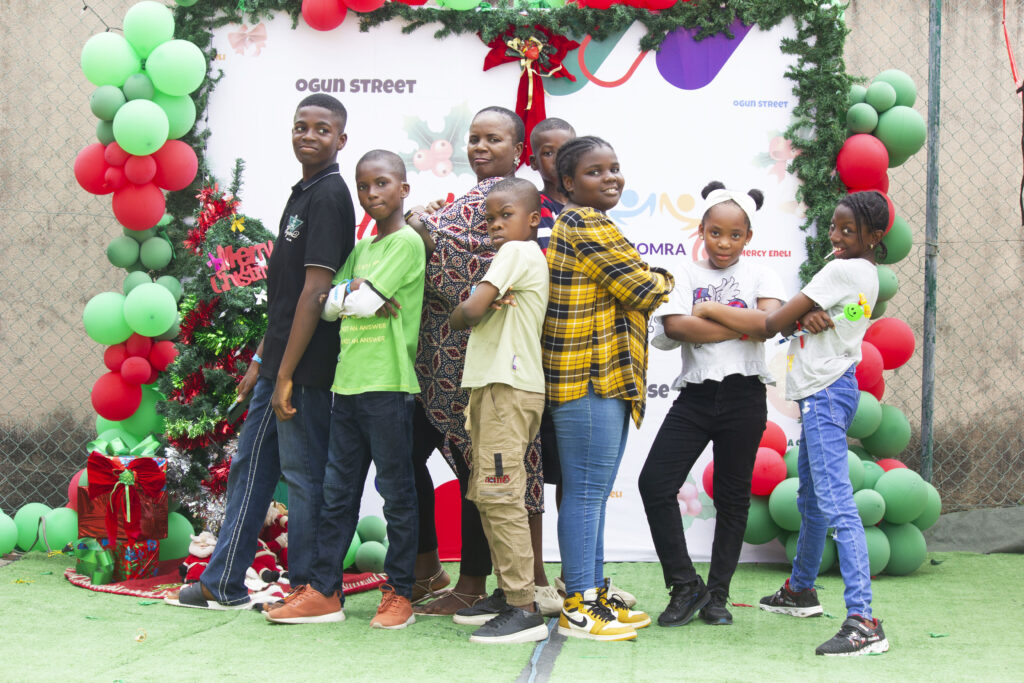 MOMRA residents enjoy a lively Christmas party featuring fun activities, awards, karaoke, and festive cheer in a vibrant atmosphere.
