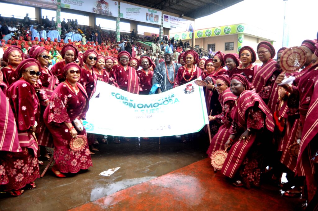 Egbe bobagunte obinrin in colourful Yoruba attire parading at Ojude Oba Festival. Tour Africa Mag