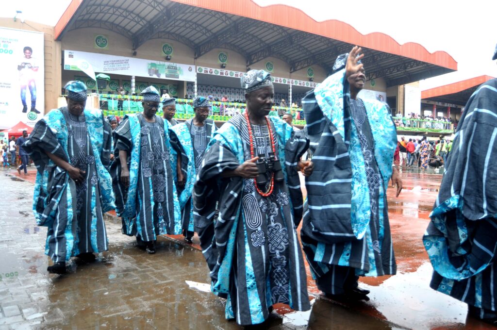 Egbe bobagunte okunrin in colourful Yoruba attire parading at Ojude Oba Festival. Tour Africa Mag