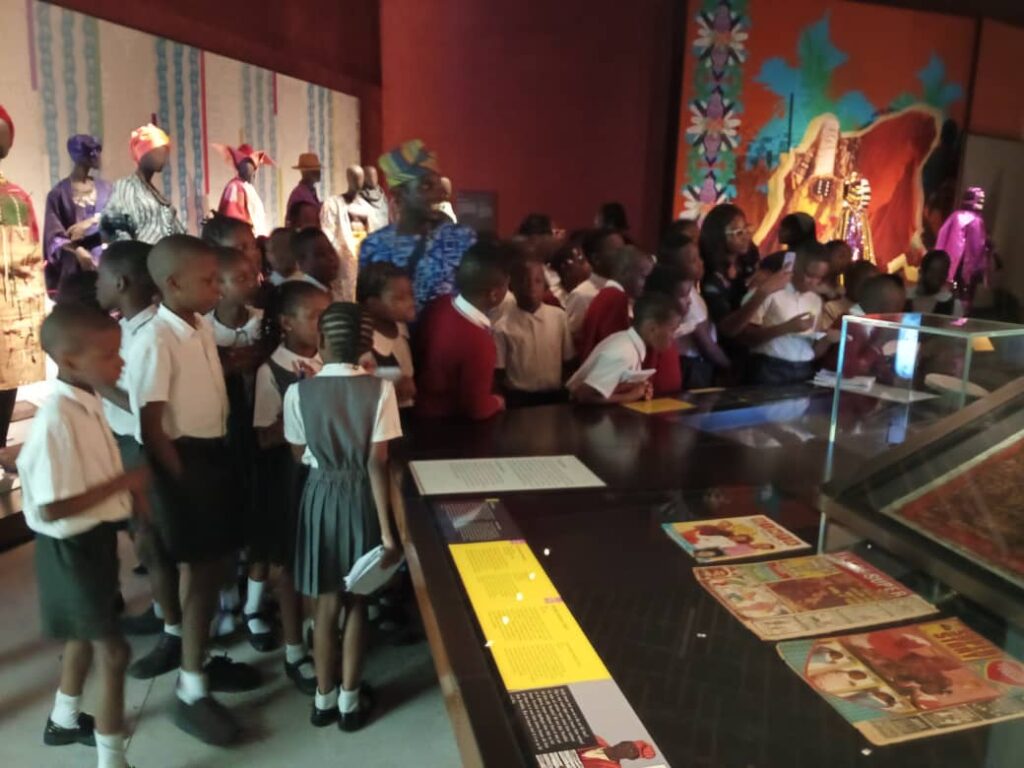 J Randle Museum Visit: Exhibit of Yoruba traditional family at J Randle Museum. Tour Africa Mag.