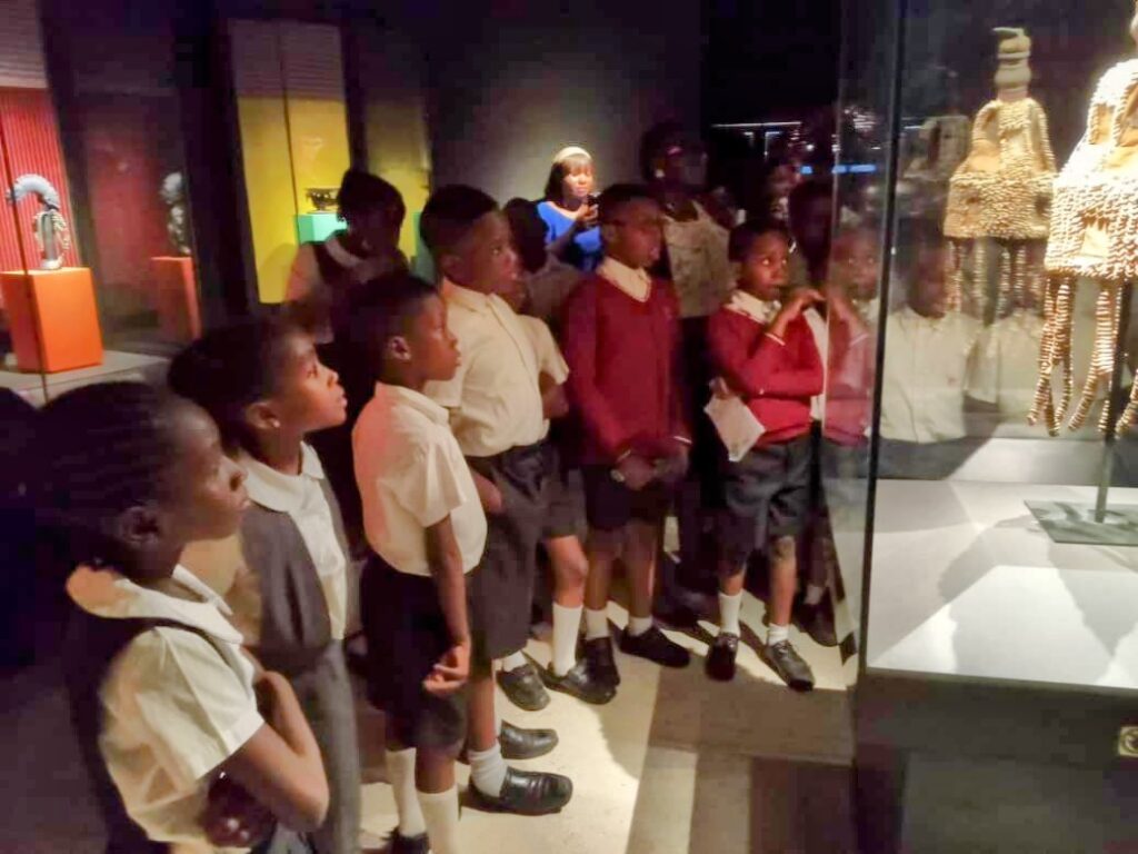 J Randle Museum Visit: Yoruba art gallery with traditional masks and sculptures. Tour Africa Mag.