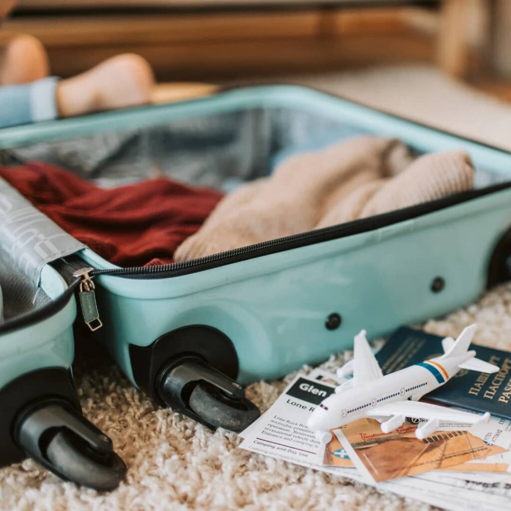 Tech-Enabled Travel: Traveler packing for a trip. Tour Africa Mag.