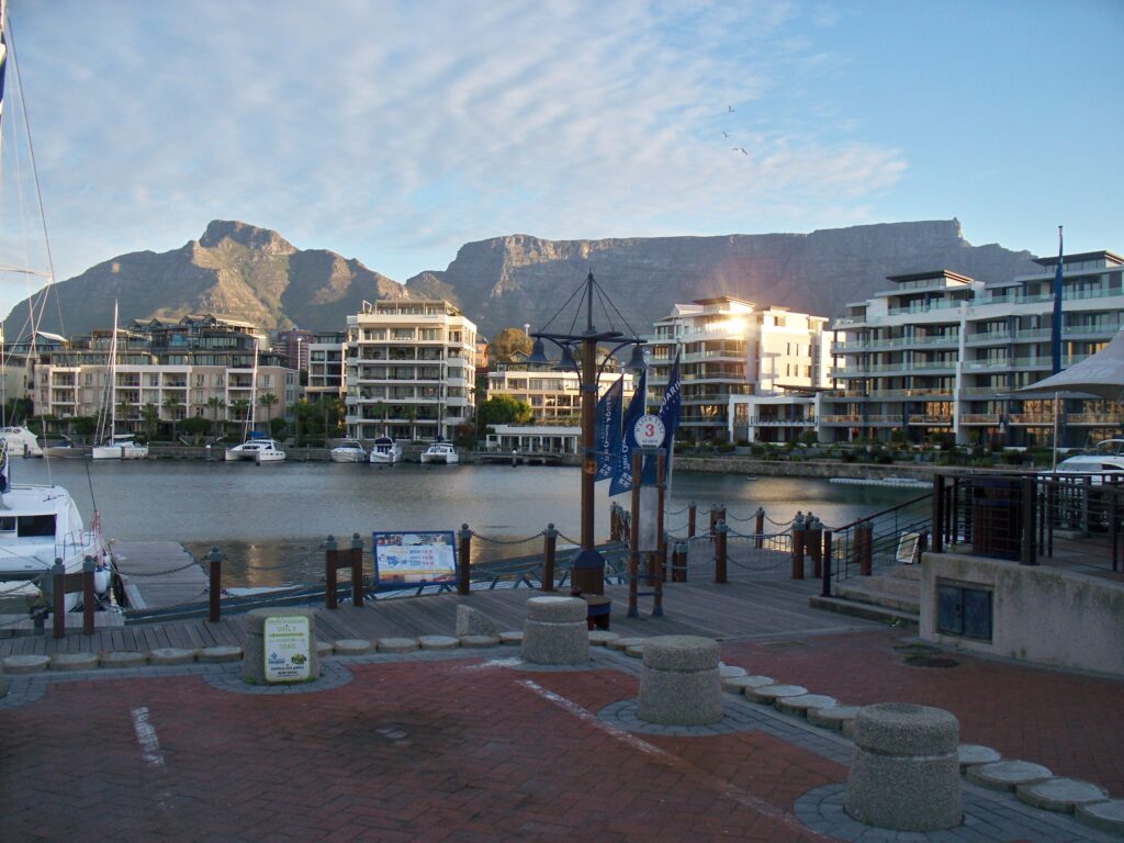 Best African Cities for Travel: Table Mountain view over Cape Town’s waterfront and leisure district. Tour Africa Mag