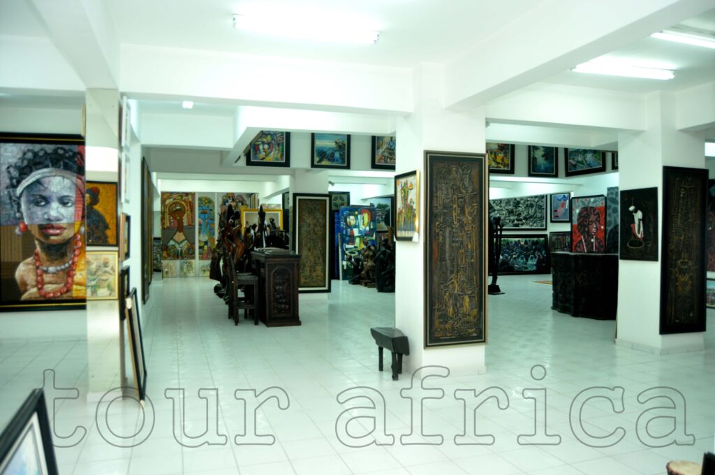 Fun Places to Visit in Lagos: Visitors exploring artworks at Nike Art Gallery Lagos, a cultural attraction in Nigeria. Tour Africa Magazine 