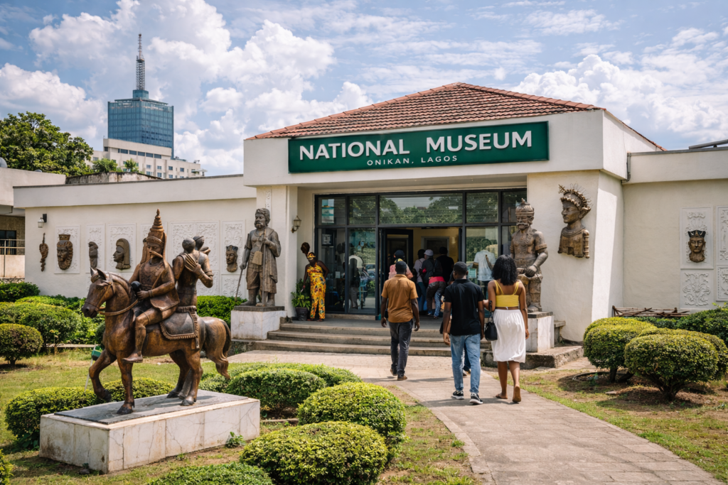 Front view of the National Museum in Onikan Lagos with sculptures and visitors entering the cultural heritage museum. Tour Africa Magazine